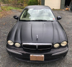 Front view of a black 2003 Jaguar X-Type sedan with manual transmission for sale.
