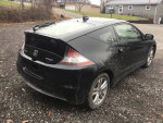 2012 Honda CR-Z Hybrid with 116,000 miles, visible rear view showing minor damage and dirt on gravel surface.