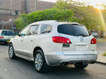2011 Buick Enclave CXL2 FWD in silver, showcasing rear view and chrome alloy wheels, parked outdoors.
