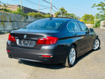 2015 BMW 5 Series 528i xDrive in black, showcasing sleek design, alloy wheels, and clean exterior.
