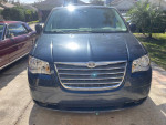 Front view of a 2009 Chrysler Town & Country with clean body and modern design.