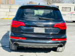 Rear view of a 2013 Audi Q7 3.0T Premium Plus in black with clean design and distinctive lights