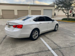 2016 Chevrolet Impala LT in clean condition, parked with a sleek exterior, showcasing its modern design and features.