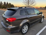 2008 Subaru Tribeca LTD AWD with 79,000 miles, featuring leather seats and clean title in a spacious outdoor parking area.