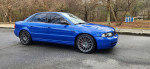 2001 Audi S4 sedan in Nogaro Blue with black leather interior parked on a street