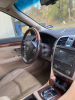 Interior view of a 2007 Cadillac SRX featuring leather seats and dashboard controls.