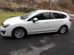 2015 Subaru Impreza in pearl white, excellent condition, for sale with AWD, heated seats, and low mileage.