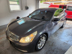 2009 Infiniti G37x in great condition, featuring leather interior and power seats, parked in a garage.