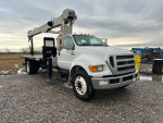 2013 Ford F750 crane truck with 18-foot flatbed and National Crane model NBT1460, excellent condition.