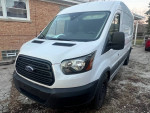 2016 Ford Transit 350 Van in white with high roof, featuring a sliding side door and slight body wear.