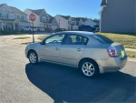 2007 Nissan Sentra FWD in very good condition with alloy wheels and keyless entry parked on street