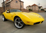 1974 Chevrolet Corvette in yellow, fully restored with stylish upgrades parked outdoors