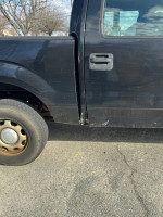 2010 Ford F-150 Supercrew showing side view with wear, four-wheel drive, V8 engine, and maintenance issues.