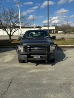 2010 Ford F-150 Supercrew truck with V8 engine, four-wheel drive, parked in a lot
