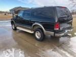 2005 Ford Excursion Eddie Bauer 4WD with new tires and low mileage, parked on a driveway.