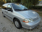 2002 Ford Windstar LX van with wheelchair lift, low mileage, silver exterior, and clean interior.