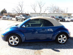 2007 Volkswagen Beetle convertible in blue with a tan top, showcasing stylish design and leather interior.