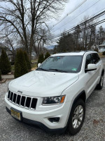 2015 Jeep Grand Cherokee in excellent condition, 106,000 miles, fully loaded with modern features for sale.