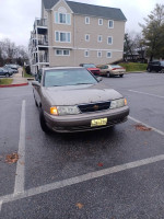 1998 Toyota Avalon XLS parked in a lot, showcasing its age and minor exterior blemishes.