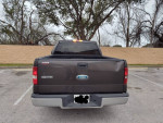 2007 Ford F150 super crew work truck for sale, 93,000 miles, gray color, showing rear with tailgate.