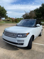 2016 Land Rover Range Rover HSE 4WD in white, showcasing its sleek design and premium features.