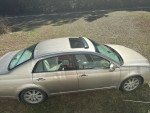 2005 Lexus ES in good condition with detailed interior, showcasing its exterior features and roof sunroof.