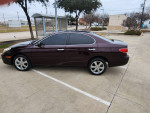 Maroon 2005 Lexus ES 330 parked with tan leather interior and chrome wheels, ready for a road trip.