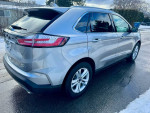 2020 Ford Edge SEL FWD in silver color, featuring sleek design and clean exterior, ideal for family travels.