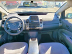 Interior view of a 2007 Toyota Prius with low mileage, featuring a clean dashboard and modern controls.