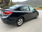 2015 Honda Civic LX in black, showcasing clean exterior and efficient design, ideal for fuel economy.