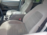 Interior view of a 2004 Ford Explorer with clean gray upholstery and spacious seating