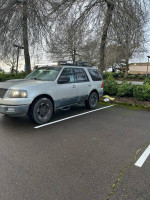 2003 Ford Expedition parked, equipped for travel with upgrades, strong engine, and spacious interior.