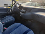 Interior view of 1993 Toyota Previa LE RWD with blue seats, ideal for travel and camping.
