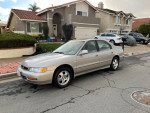 1997 Honda Accord Special Edition FWD parked on the street, showcasing its silver exterior and good condition.