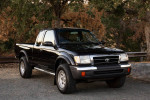1998 Toyota Tacoma SR5 4WD in black, featuring an extended cab and 60,000 miles on the odometer.