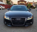 Front view of a 2010 Audi A5 3.2 Premium Plus coupe in black with Quattro AWD in a residential area