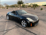 2008 Nissan 350Z convertible in black, 132,000 miles, well-maintained, parked outdoors