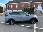 2021 Honda CRV EX with 19K miles in gray, parked outside with clean exterior and modern features.