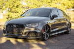 2019 Audi RS3 in Daytona Gray Pearl Effect, showcasing luxury and performance, parked outdoors.