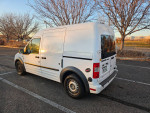 White transit van parked in a lot, ideal for contractors and camping, located in Grand Junction.