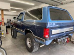 1990 Dodge Ramcharger 4x4, blue SUV with off-road capabilities, in garage setting