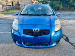 Front view of a blue 2007 Toyota Yaris hatchback in excellent condition with low mileage