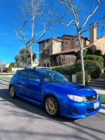 2013 Subaru Impreza WRX Hatchback in blue, excellent mechanical condition, located in a residential area.