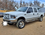 2000 Ford F250 Super Duty 4x4 truck with 267,000 miles, featuring upgraded parts and heavy-duty towing capabilities.