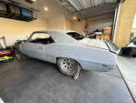 1969 Chevrolet Camaro project car stored indoors with partially built 454 engine and Muncie transmission.