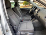 Interior view of a 2016 Volkswagen Tiguan S 4Motion, featuring gray seats and dashboard layout.