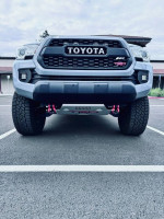 Front view of a 2021 Toyota Tacoma SR5 4WD, showcasing powerful design and off-road features.