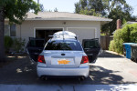 2008 Subaru Impreza WRX AWD with custom rims and exhaust parked in a driveway