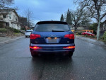 2008 Audi Q7 SUV parked on a street, showcasing its rear design and clean title status.