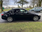 2009 Hyundai Genesis sedan in original condition with alloy wheels parked on the street